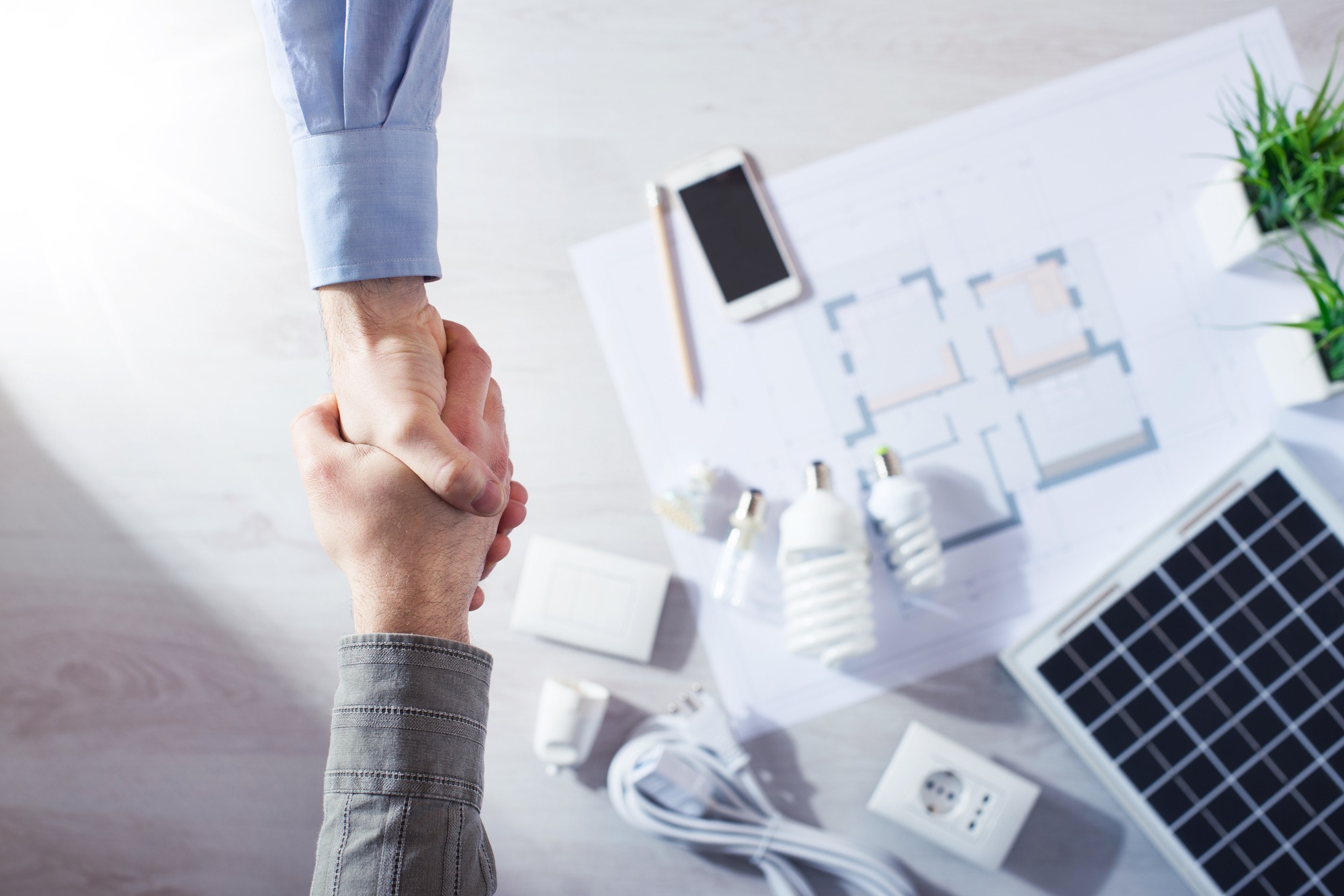 Contractor and Customer Shaking Hands Close Up.